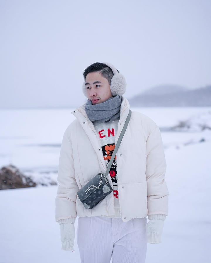 Adrian Cotoco in the snow in South Korea, travelling with Avian Summit Travel