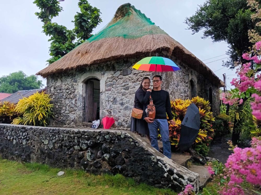 An Avian couple at a traditional stone house in Batanes