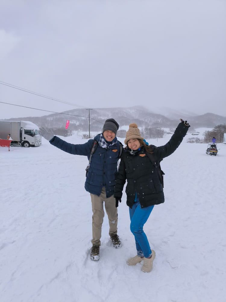 An Avian couple celebrating in the snow in Hokkaido, Japan